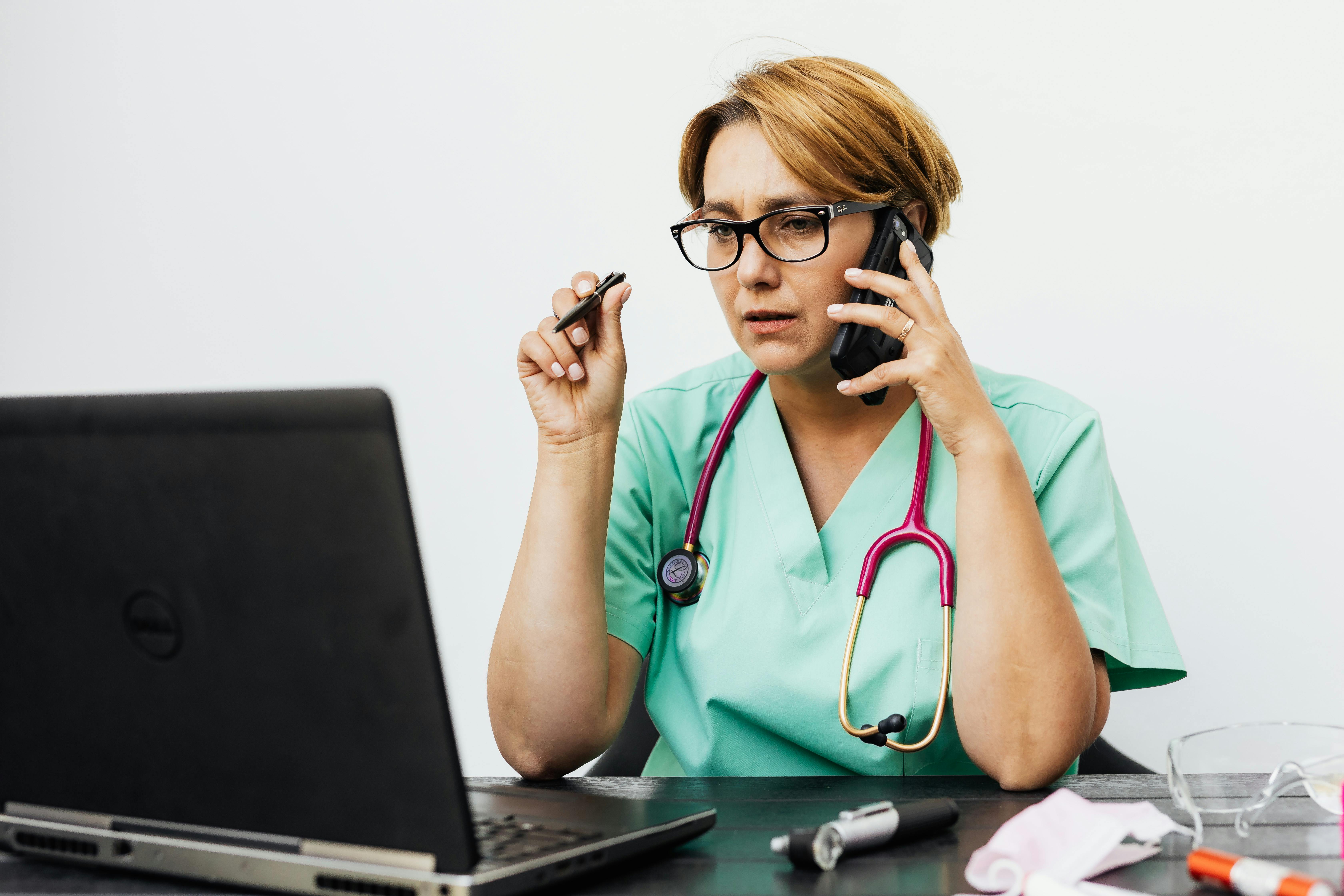 Healthcare professional on phone call providing a voice check-in between client visits